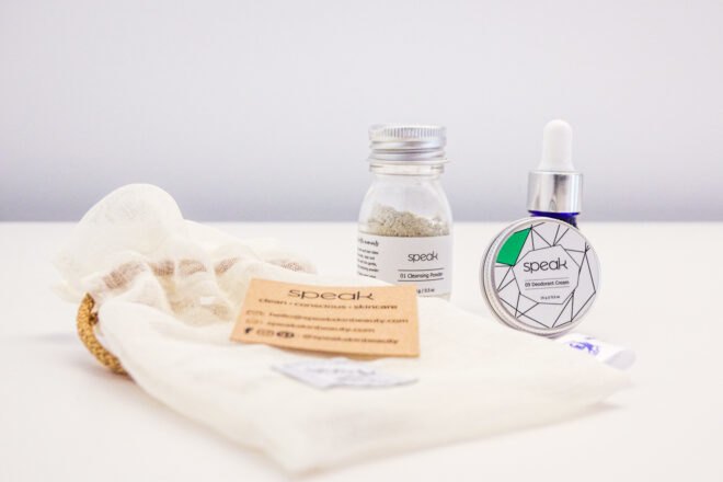 reusable pouch, glass jar, blue amber bottle and metal tin of skincare