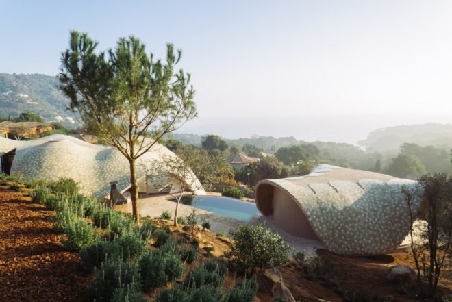 two domed structures separated by a swimming pool