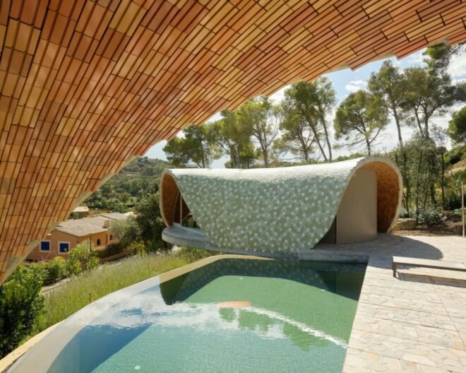 domed home with ceramic tile facade