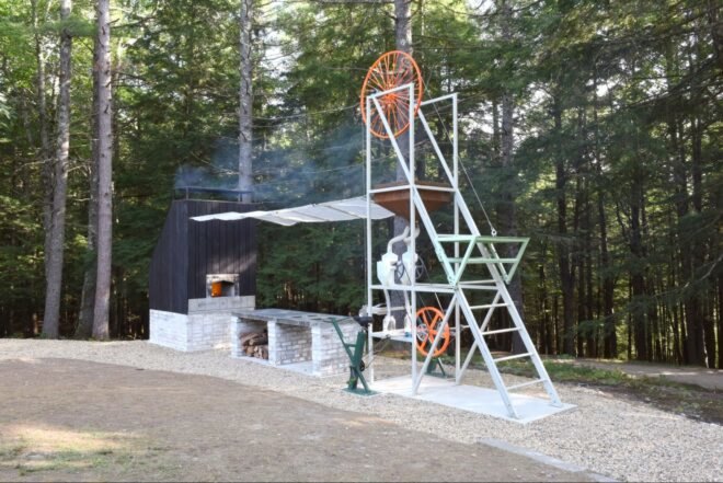 machine with large wheel and firewood