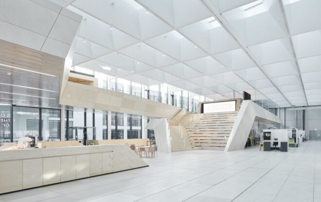 white building with skylights and large staircase