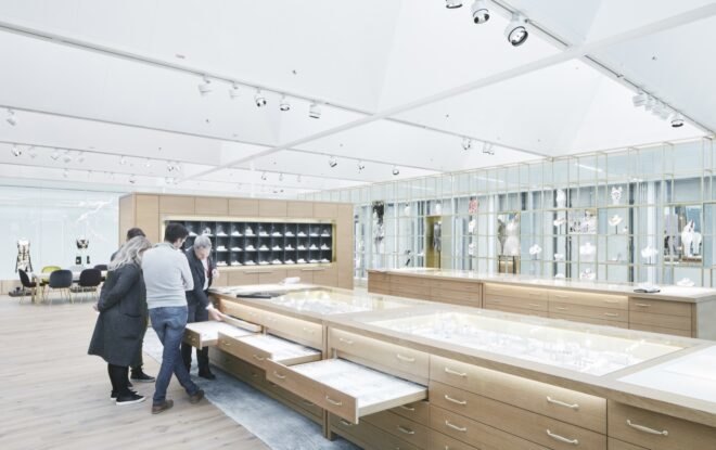 people looking at jewels in drawers