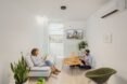 two people in an all-white living space