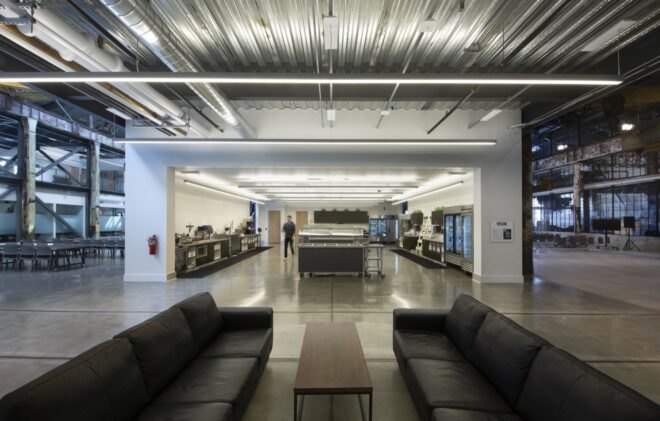 black couches inside a bright industrial building