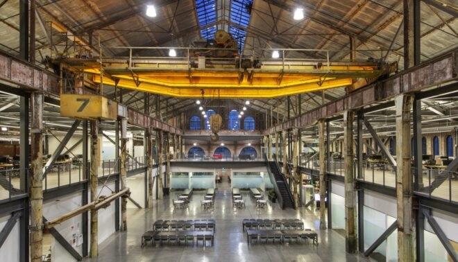 interior of industrial building with many seats and tables