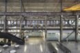 rows of desks inside industrial building