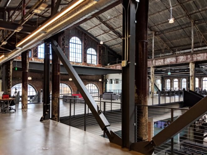 gray couches in huge industrial building