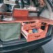 dark camper van with open storage drawers