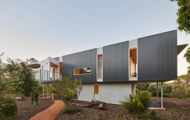 white and gray home on stilts