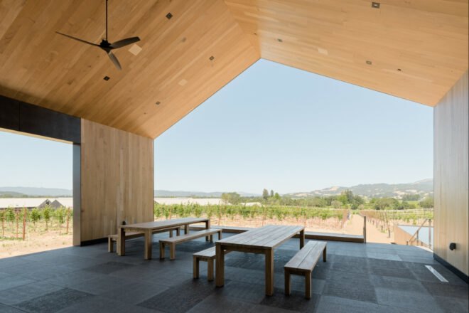 wood-lined covered seating area with tables