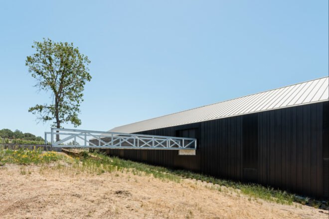 long extended building with gabled roof