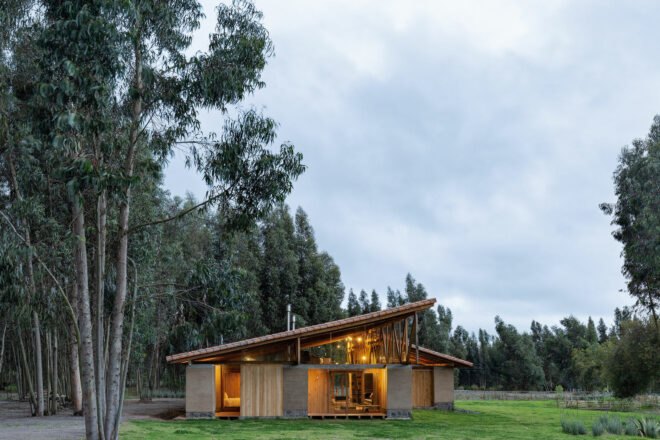 rammed earth home with slanted roof near forest