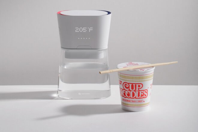 carafe of water near cup of noodles