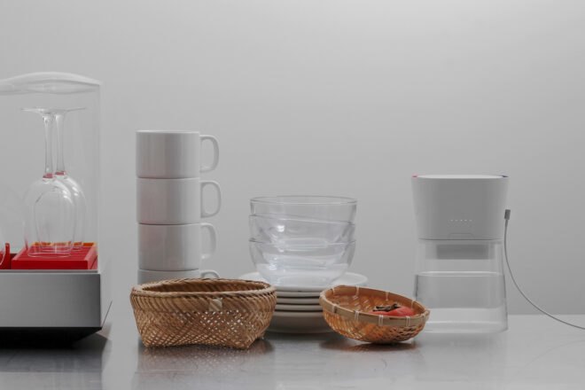 white carafe near stacked dishes
