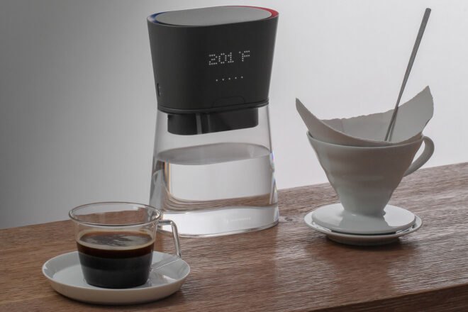 carafe on table near coffee cup