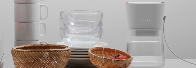 white carafe near stacked dishes