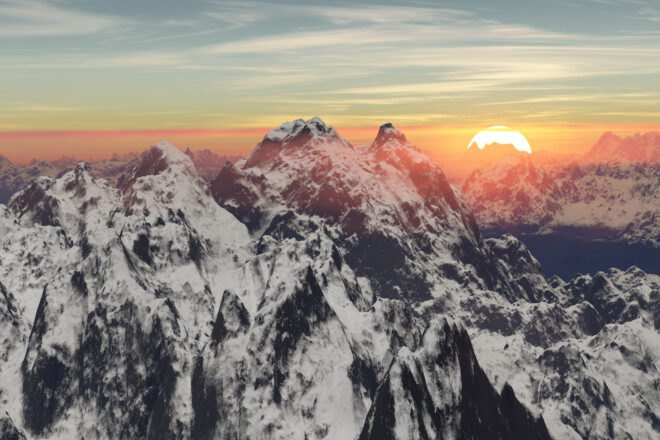 aerial view of mountaintops at sunset
