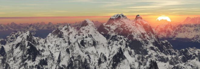 aerial view of mountaintops at sunset