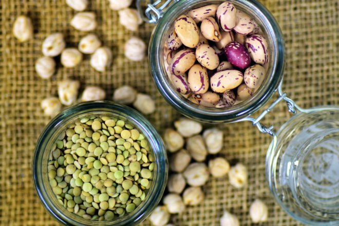 aerial view of lentils and beans in glass jars