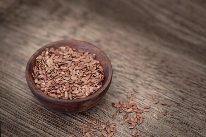 small wood bowl of flax seeds