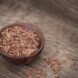 small wood bowl of flax seeds