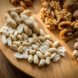 wooden board covered in variety of nuts