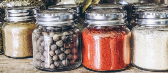 spices in glass jars on a shelf