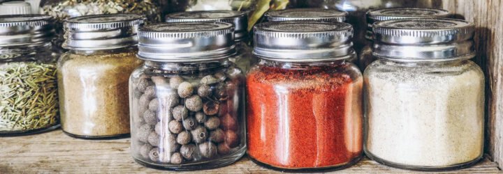 spices in glass jars on a shelf