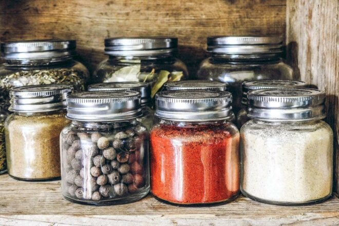 spices in glass jars on a shelf