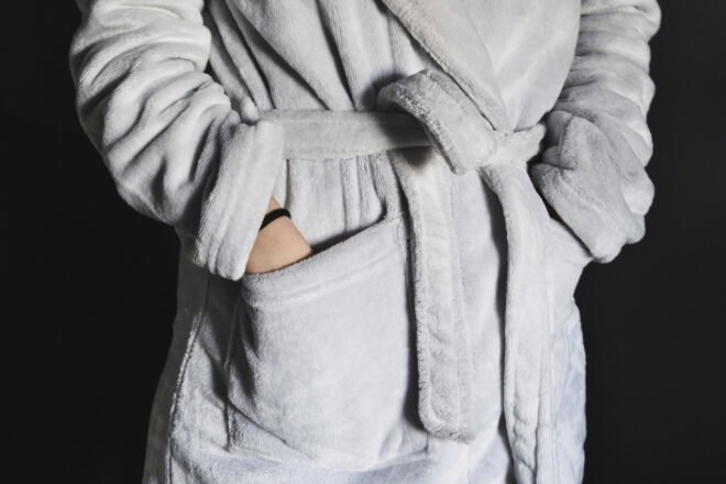person wearing fuzzy gray robe