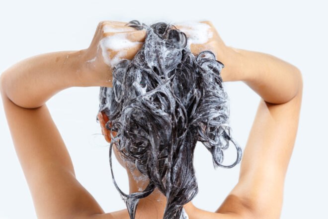 woman shampooing hair