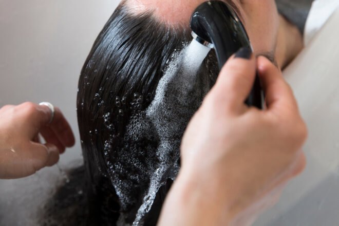 hairdresser washing women's hair