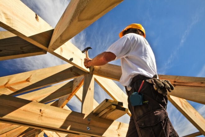 man building a house