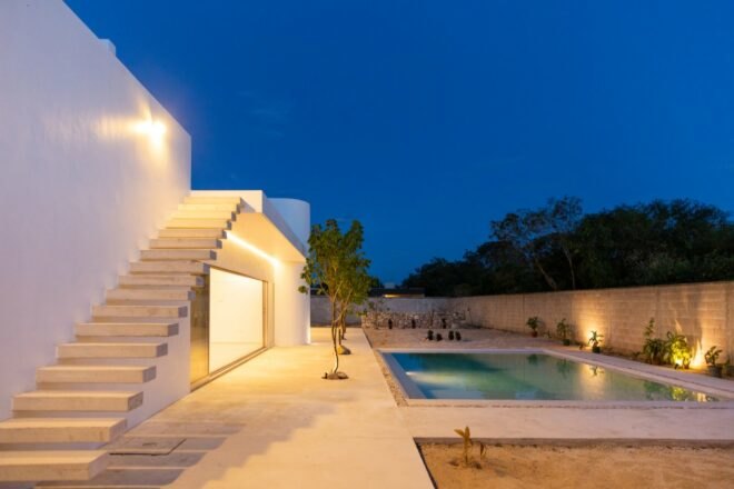 white home with swimming pool and spacious outdoor deck