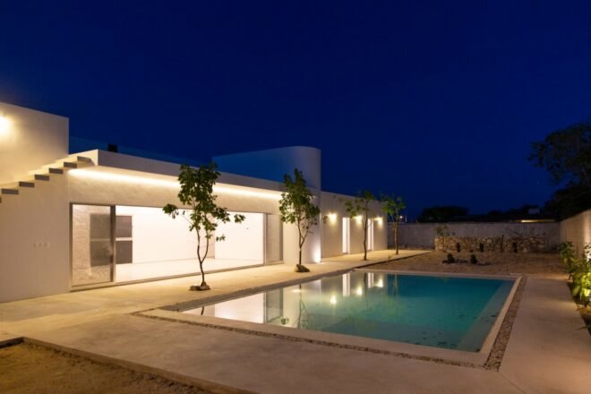 white home lit up at night