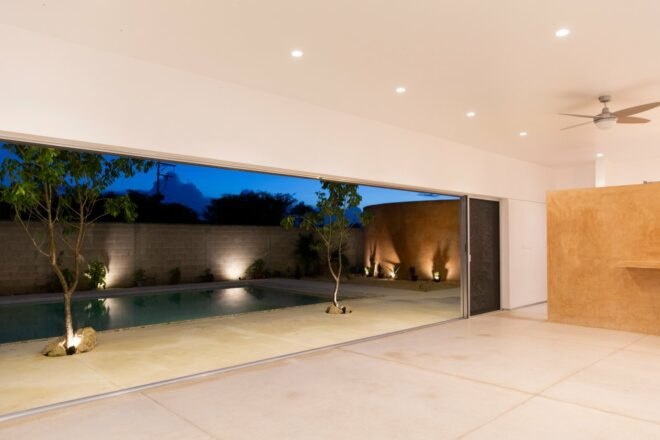 large opening that leads out to swimming pool