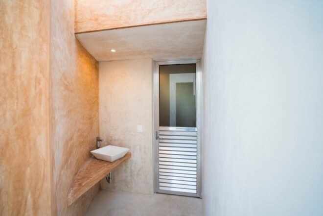 stuccoed walls with sink
