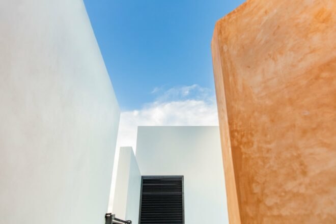 white building with stucco wall