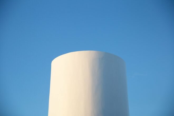 white round tower against blue tower
