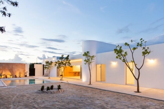 all-white home with cylindrical volumes