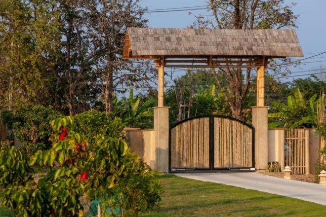 bamboo gate surrounded by plants