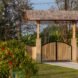 bamboo gate surrounded by plants