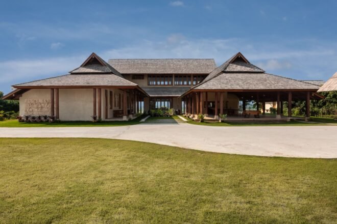 adobe brick home with multiple pitched roofs