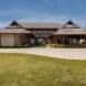 adobe brick home with multiple pitched roofs