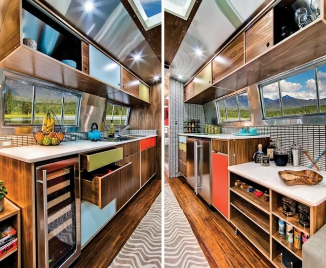 Airstream interior with kitchen with white counters and wood cabinets