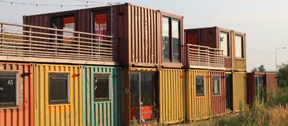 multi-colored shipping containers turned into home
