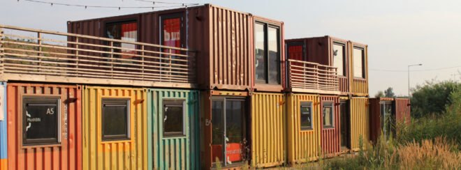 multi-colored shipping containers turned into home