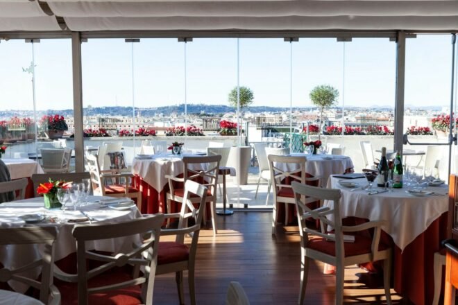 restaurant with white tables and glass walls