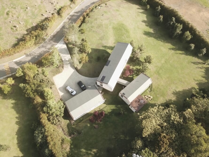 aerial view of three connected concrete volumes