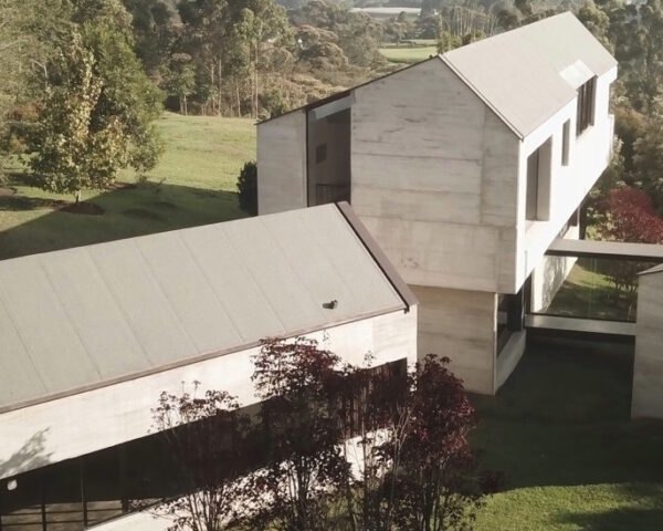 concrete home with three connected volumes